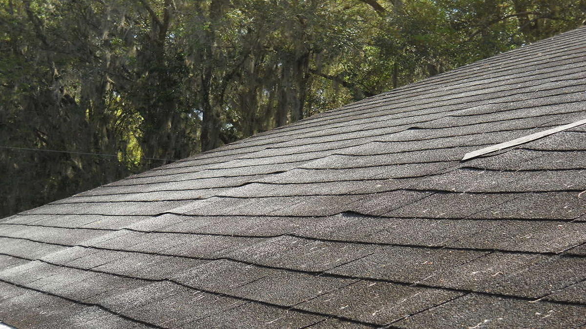 Image of a sagging roof deck in Louisville, illustrating structural damage and potential leaks.